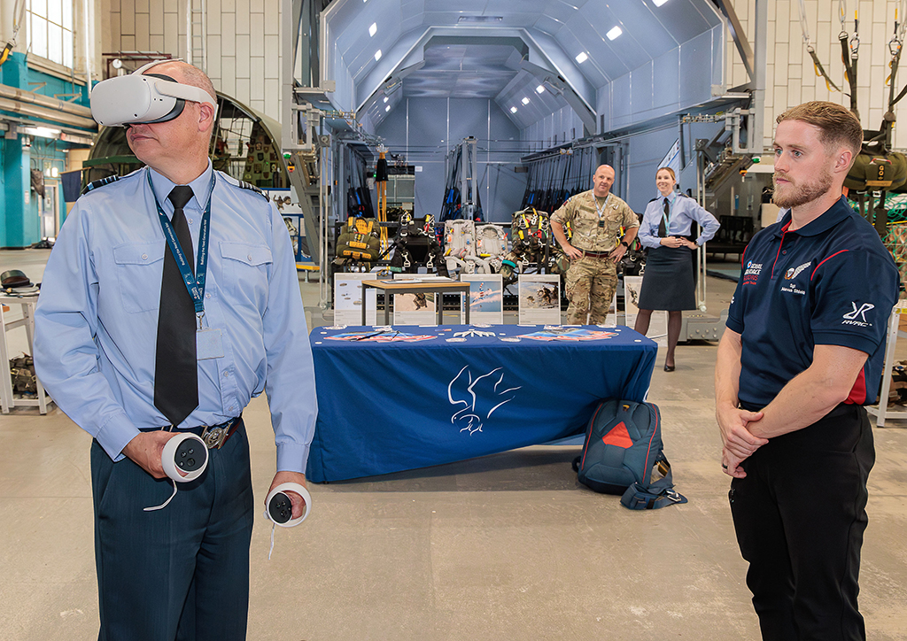 The Deputy Chief of the Air Staff, Air Marshal Paul Lloyd CBE MSc MA MDA BEng CEng FIMechE RAF, getting to grips with the Virtual Reality Falcons Display system